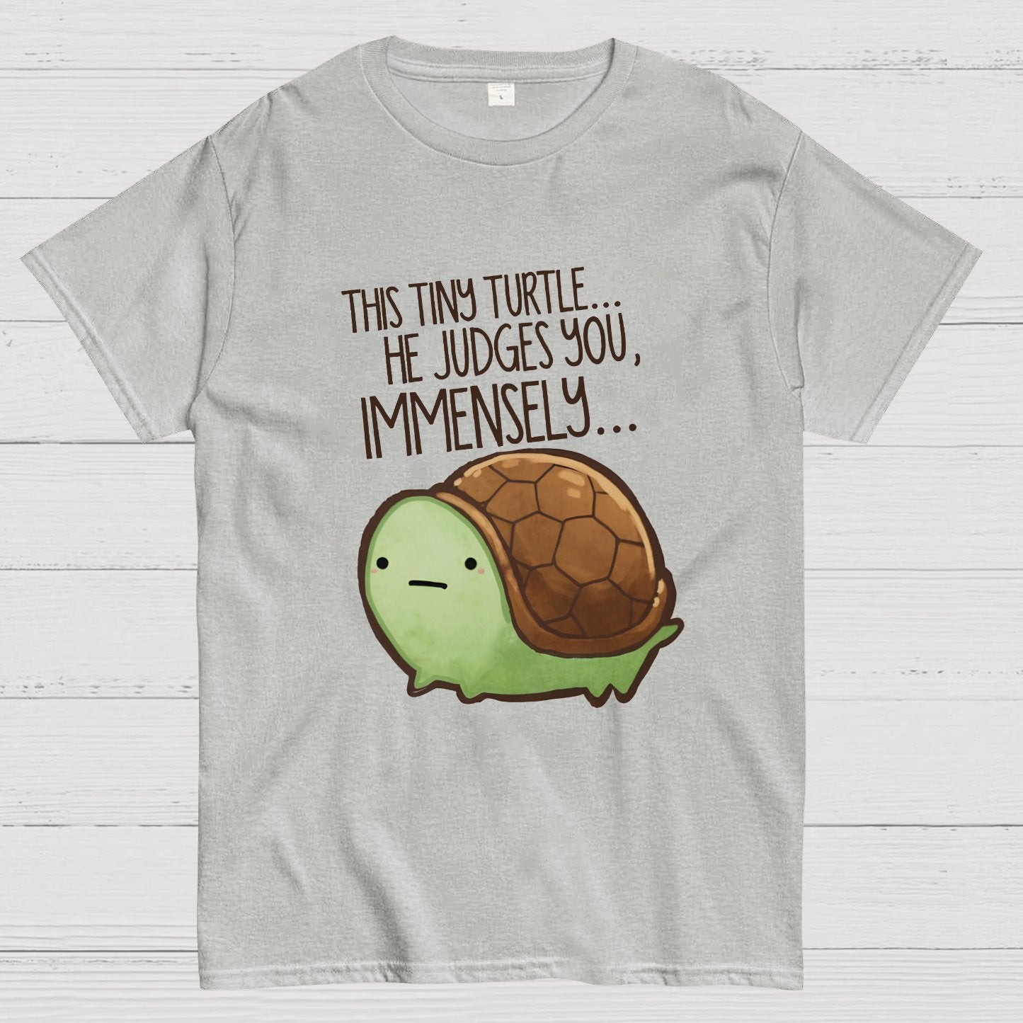 This turtle.. he judges you. Essential Geeky T-Shirt